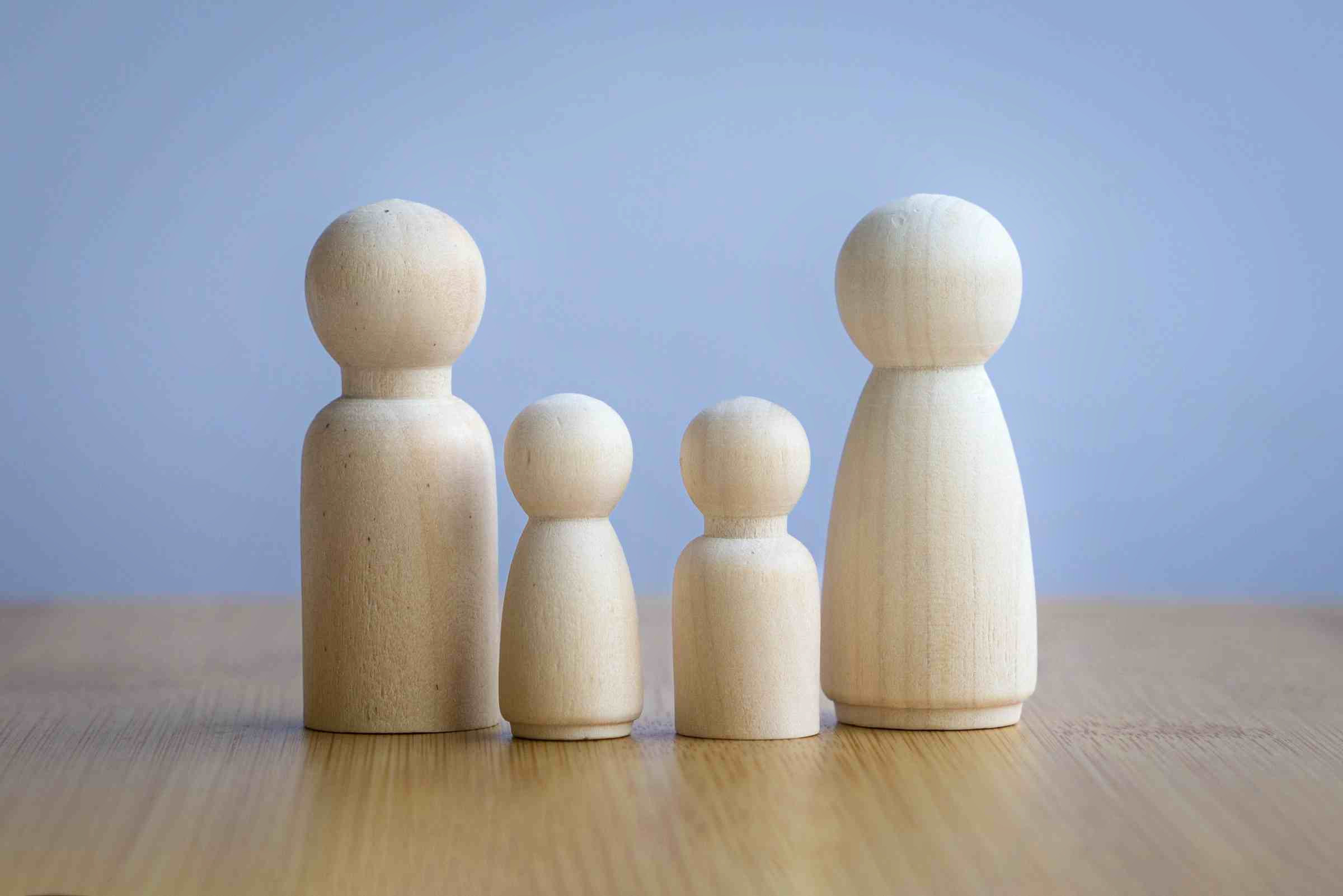 Wooden,Dolls,Depicting,Father,,Mother,,Son,And,Daughter.,Family,Concept.